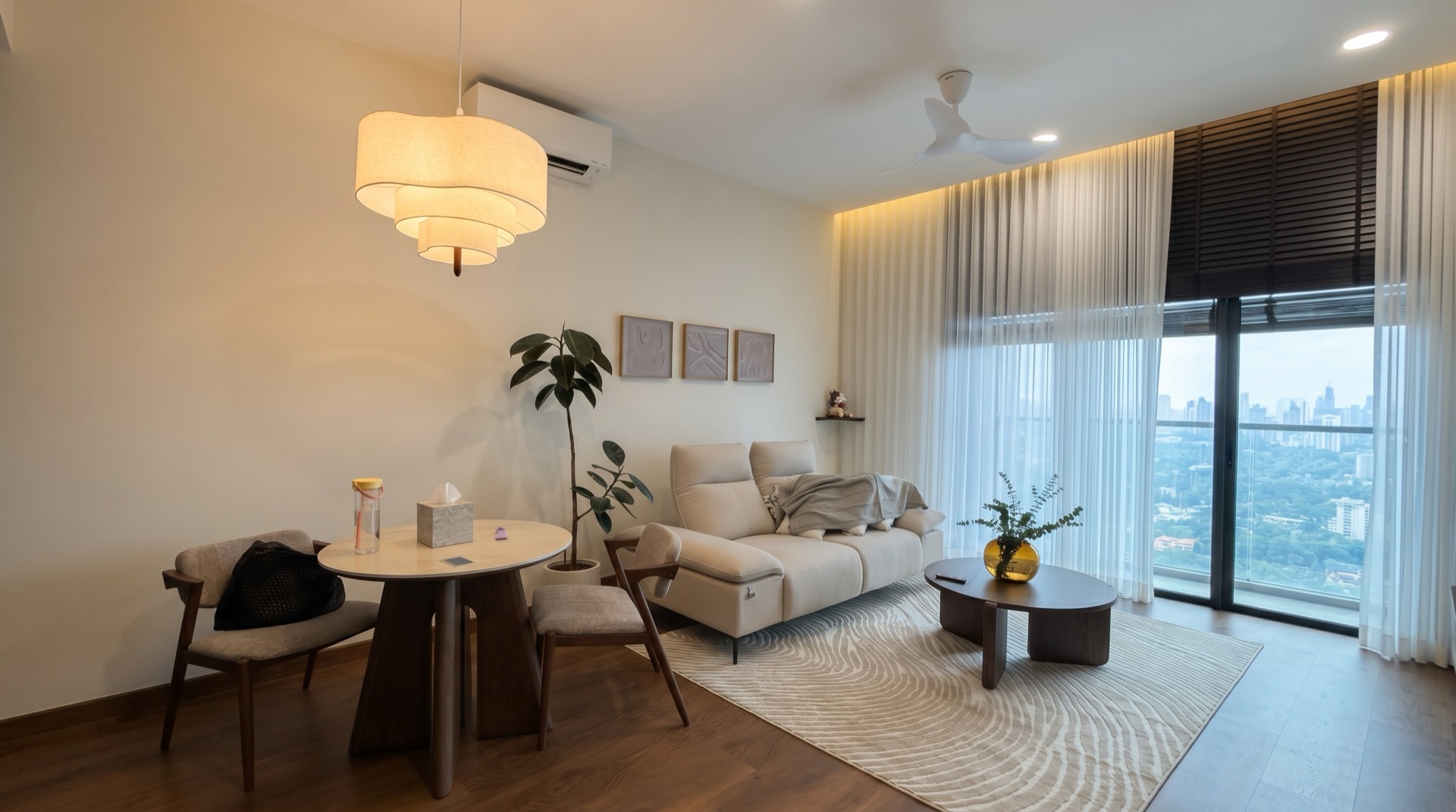 Living room furniture assembled by FIX & SHAPE in a Klang Valley high-rise, KL skyline beyond the window